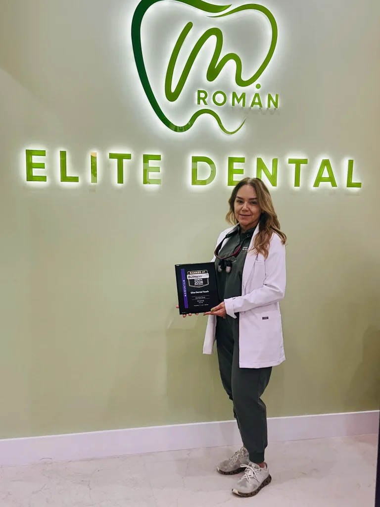 Dr. Maria A. Roman holding the BusinessRate Ranked #1 award